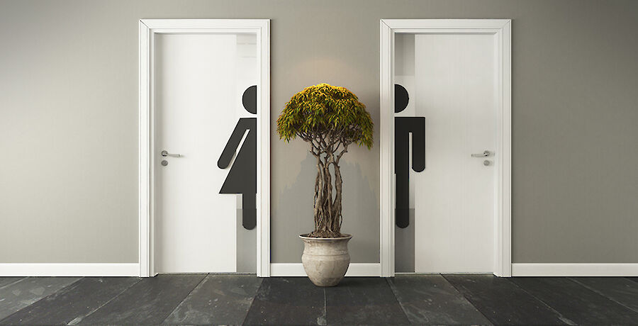 Toilettentüren mit Frau- und Mann Icons.